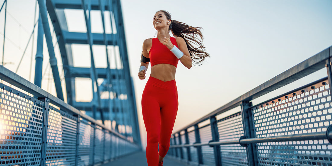 A woman is running on the bridge.